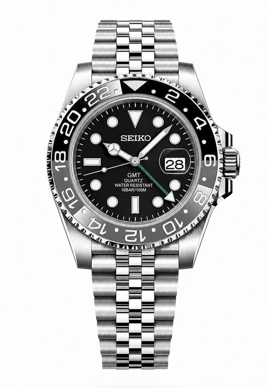 A Seiko GMT Quartz watch with a stainless steel Oyster bracelet, featuring a black dial, black bezel, and silver-tone case and bracelet, shown against a plain white background.