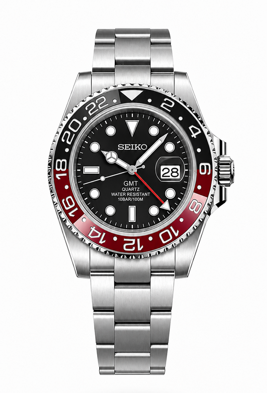 A Seiko GMT Quartz wristwatch with a stainless steel link bracelet, featuring a black dial, a black and red two-tone bezel, and a date window at 3 o'clock, shown against a plain white background.