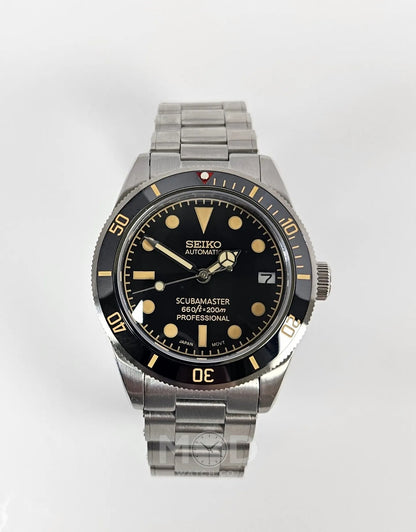 Seiko watch with black dial and silver metal strap on a white background