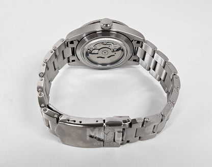 Silver watch with a detailed mechanism on a white background