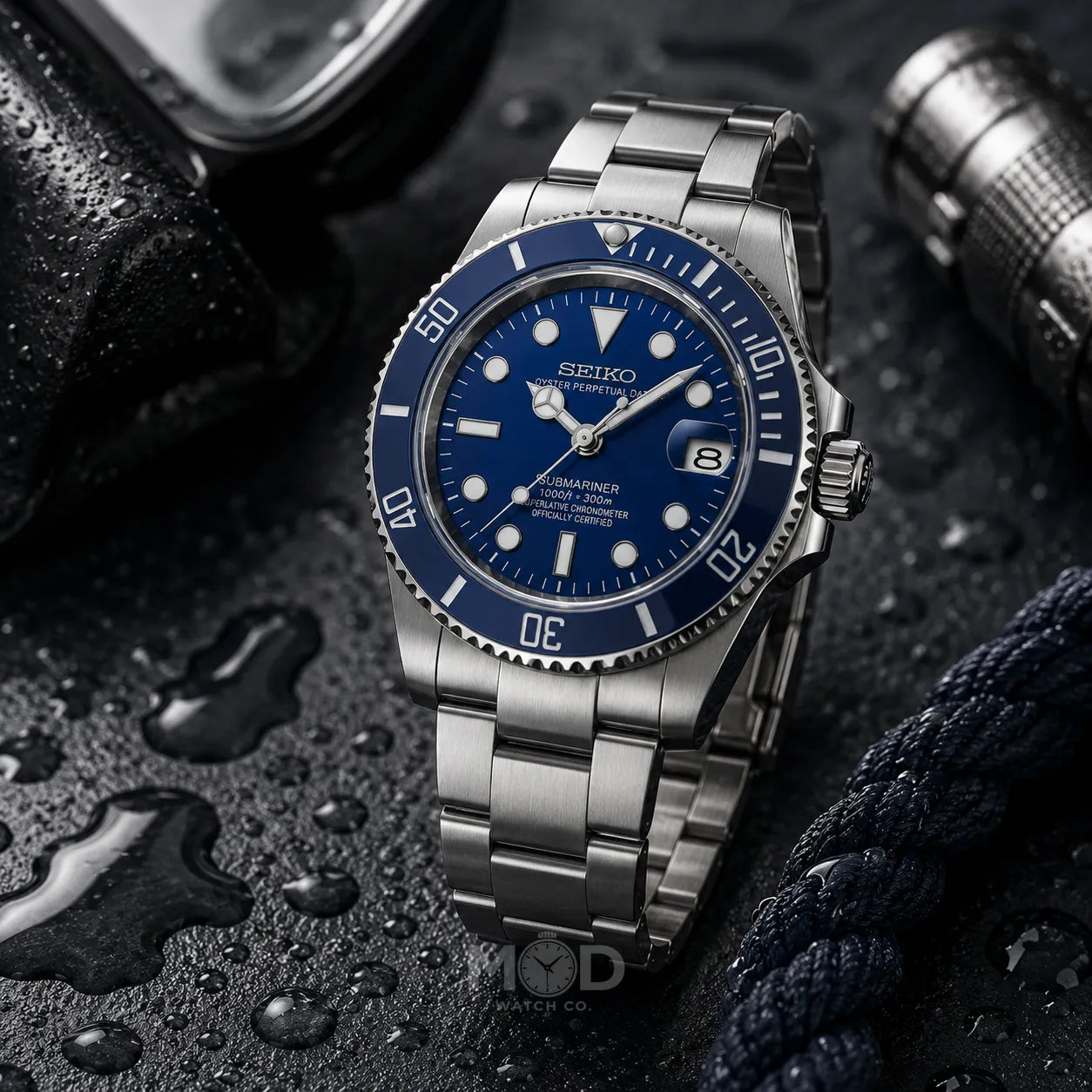 Seiko watch with blue dial and silver metal strap on a dark textured background