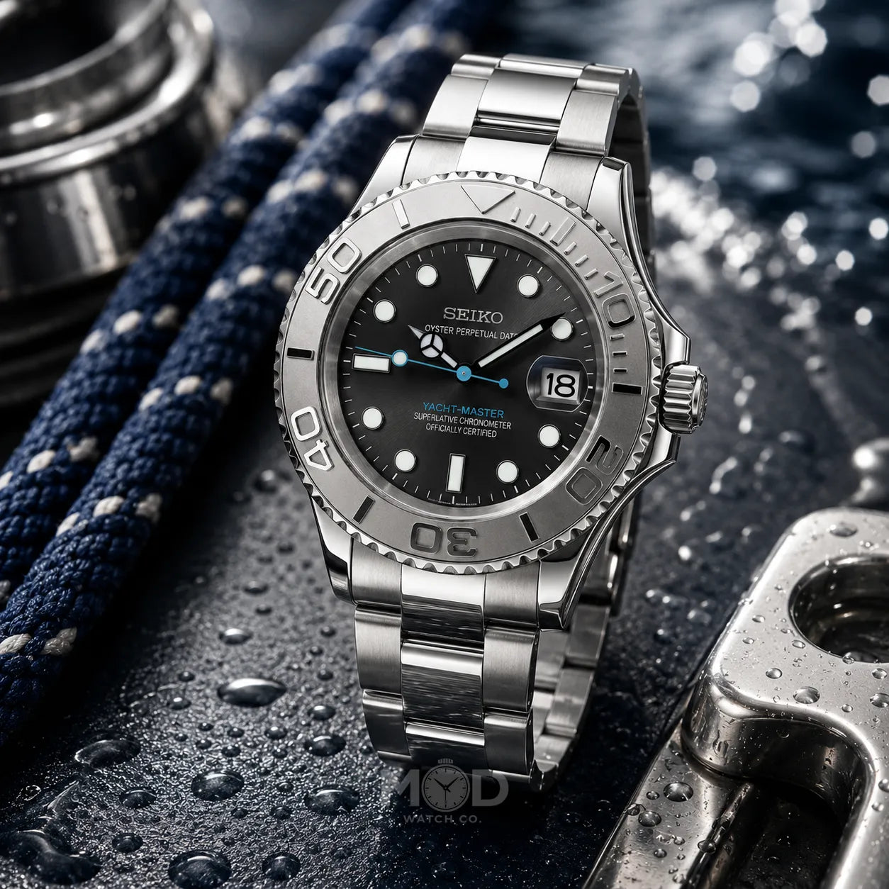 Silver Seiko watch with black dial on a textured surface