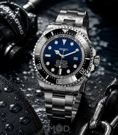 Silver Seiko watch with blue dial on a dark background
