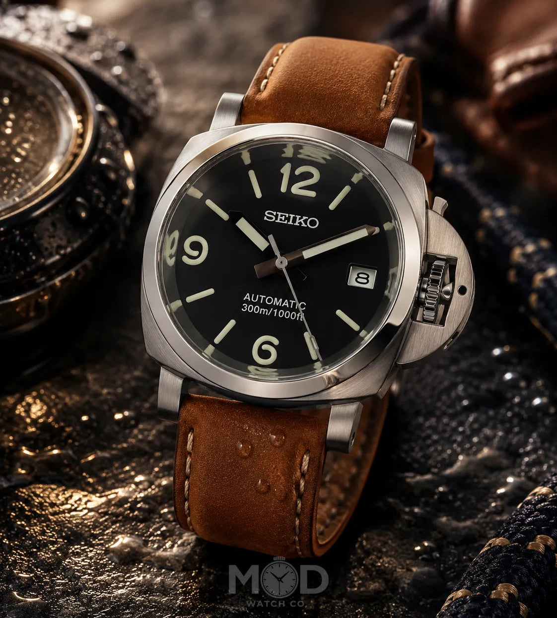 Seiko watch with brown leather strap on a textured surface