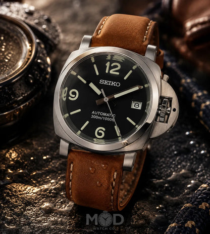 Seiko watch with brown leather strap on a textured surface