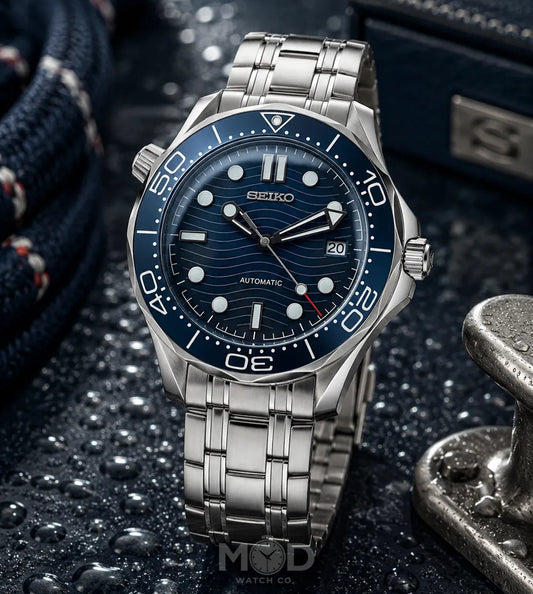 Seiko watch with blue dial and silver metal strap on a dark textured background