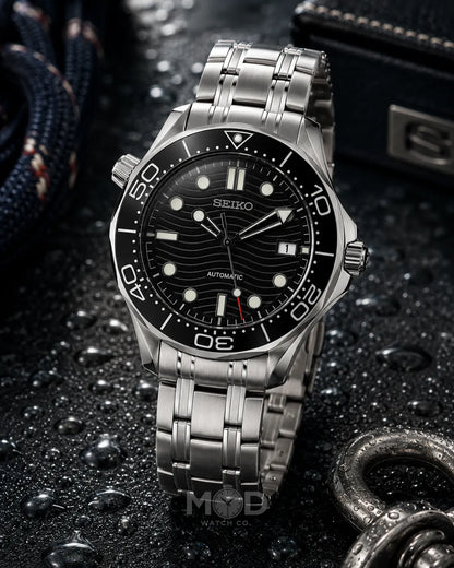 Seiko watch with a black dial and silver metal strap on a dark textured background