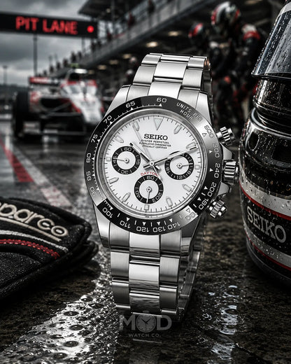 Seiko watch with racing theme, including a race car and 'Pit Lane' sign.