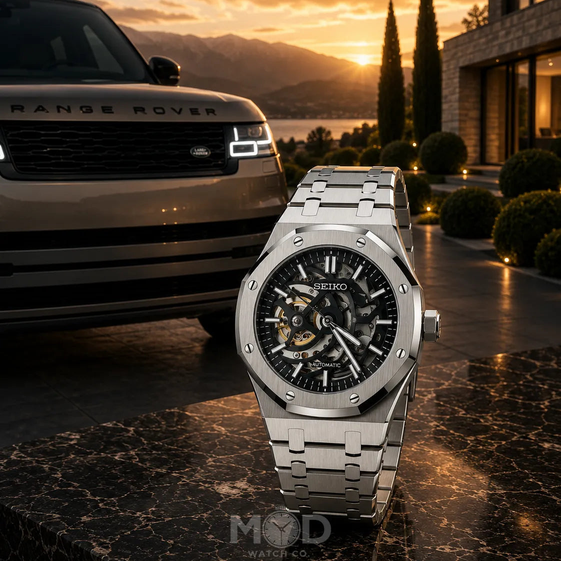 Luxury watch with Seiko branding in front of a Range Rover and sunset background