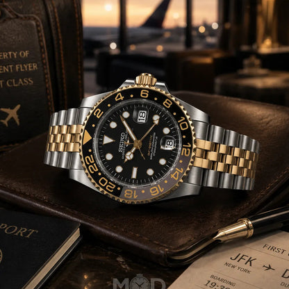 Luxury watch with gold and silver accents on a travel-themed background