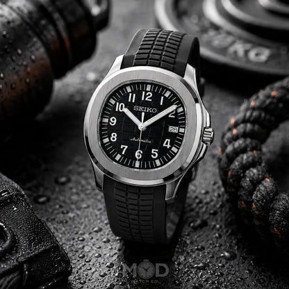 Seiko watch with black strap on a textured surface