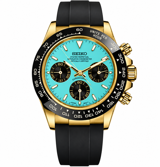 A Seiko Oyster Perpetual Superlative Chronometer Automatic watch with a gold-tone case, black bezel, turquoise dial, and black rubber strap, shown on a white background.