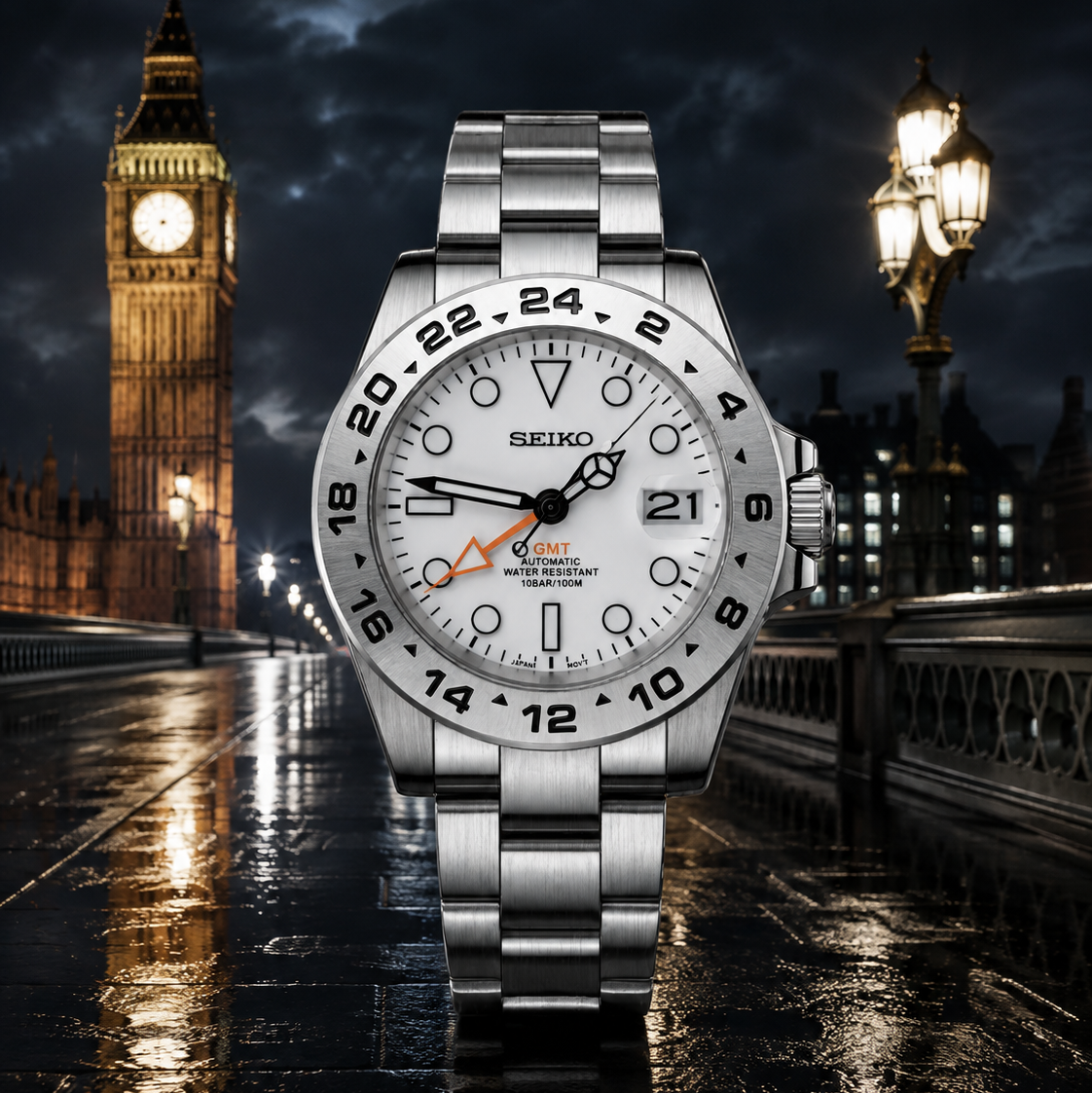 A silver stainless steel wristwatch with a white dial and black 24-hour bezel, positioned centrally against a nighttime London backdrop featuring Big Ben and a wet street reflecting lights.