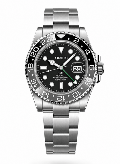 A Seiko GMT Quartz watch with a stainless steel bracelet, black dial, and black bezel with white numerals, shown on a white background.
