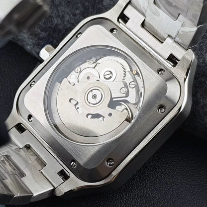 Close-up of a silver watch with a visible mechanical movement on a dark background