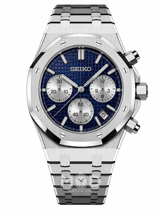 A Seiko stainless steel chronograph watch with a blue textured dial, silver subdials, and a matching steel link bracelet, shown against a plain white background.